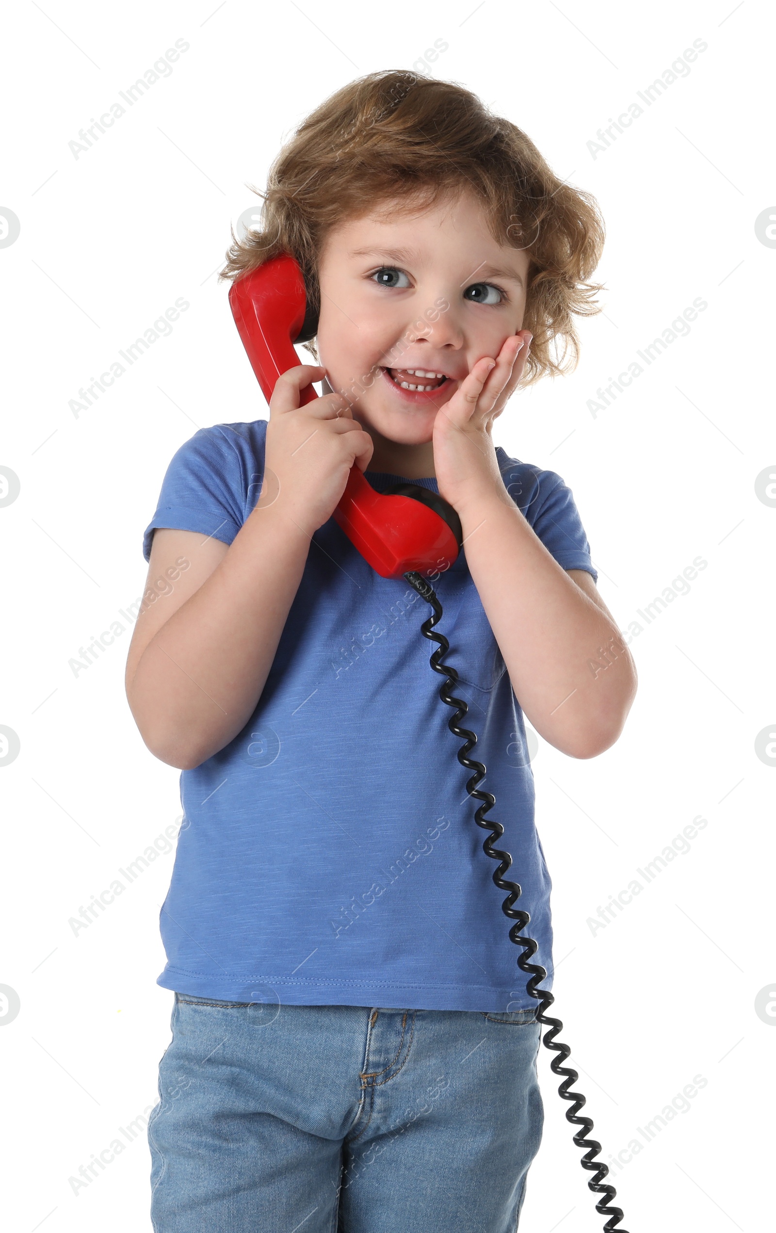 Photo of Cute little boy with telephone handset on white background