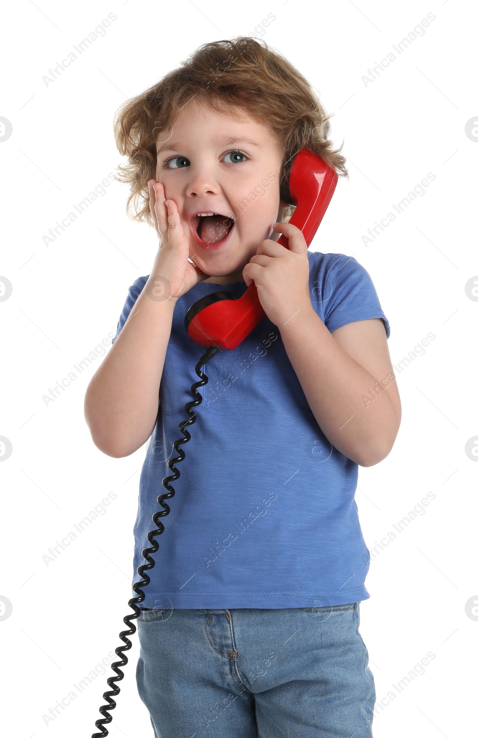 Photo of Cute little boy with telephone handset on white background