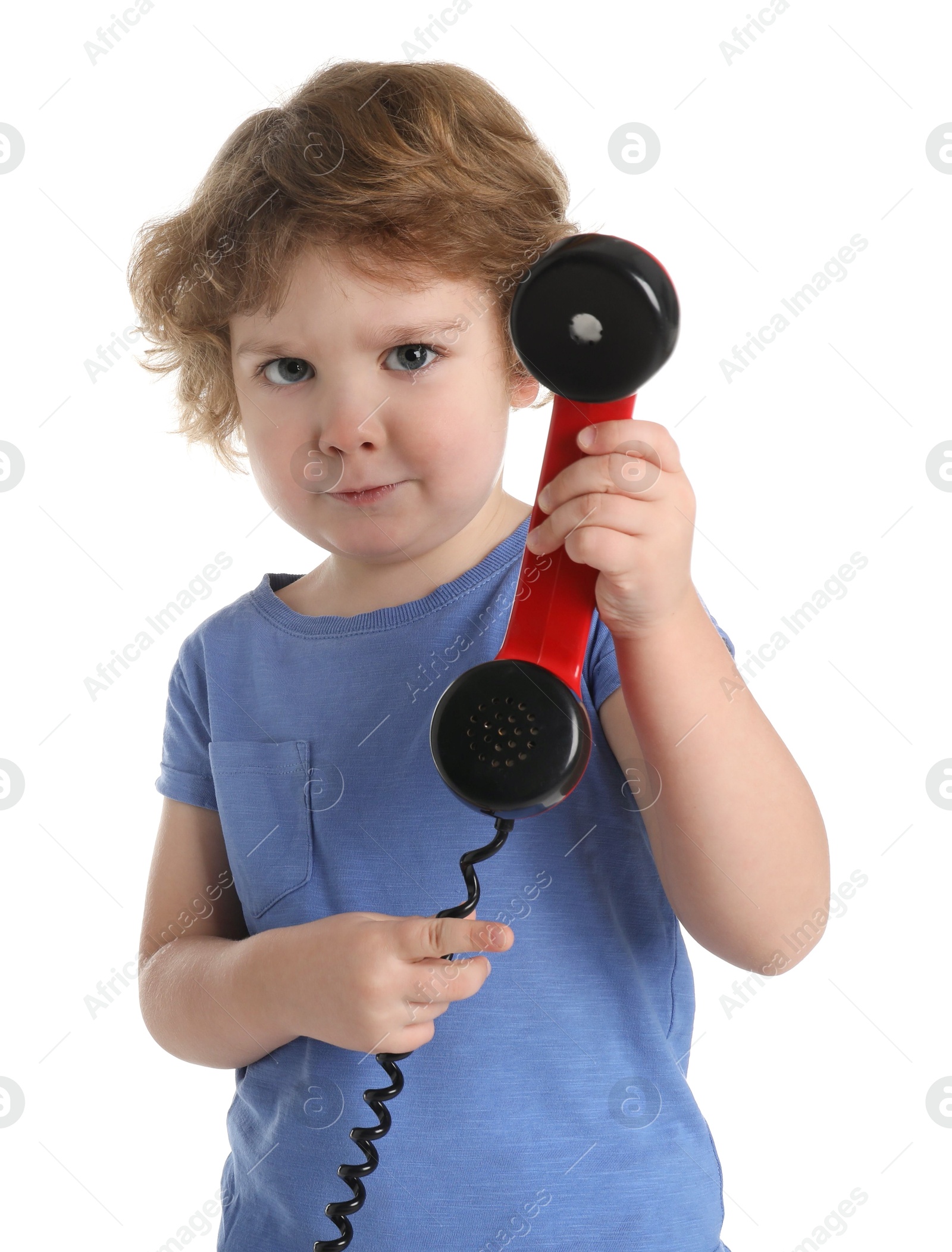 Photo of Cute little boy with telephone handset on white background