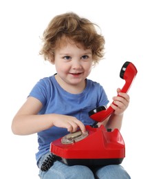 Photo of Cute little boy with telephone on white background