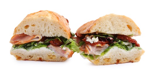 Photo of Delicious sandwiches with prosciutto and sun dried tomatoes isolated on white