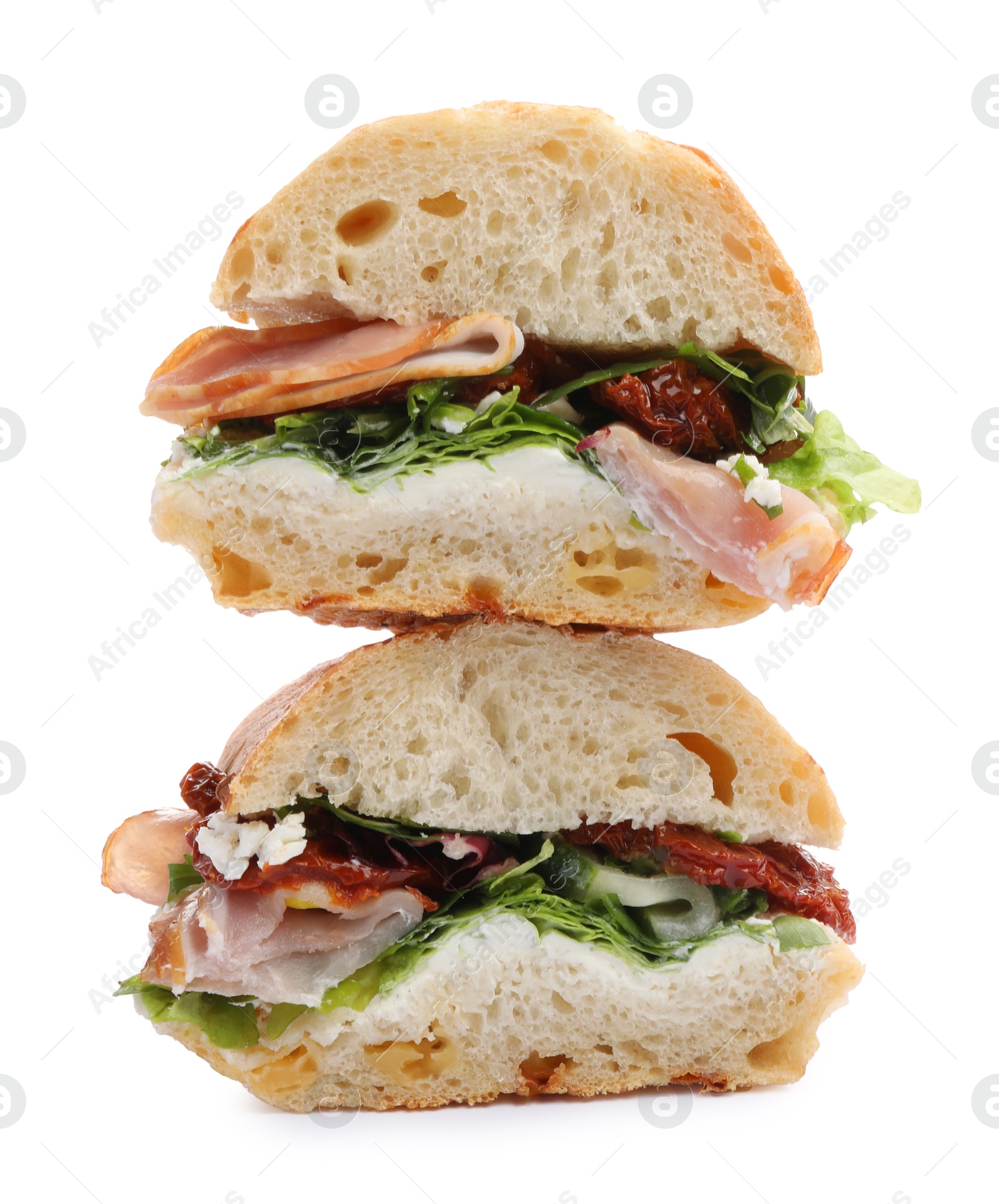 Photo of Delicious sandwiches with prosciutto and sun dried tomatoes isolated on white