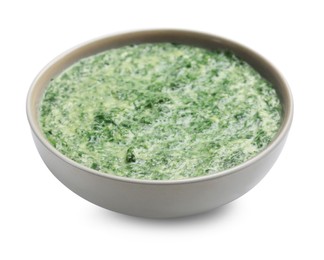 Photo of Delicious spinach sauce in bowl isolated on white