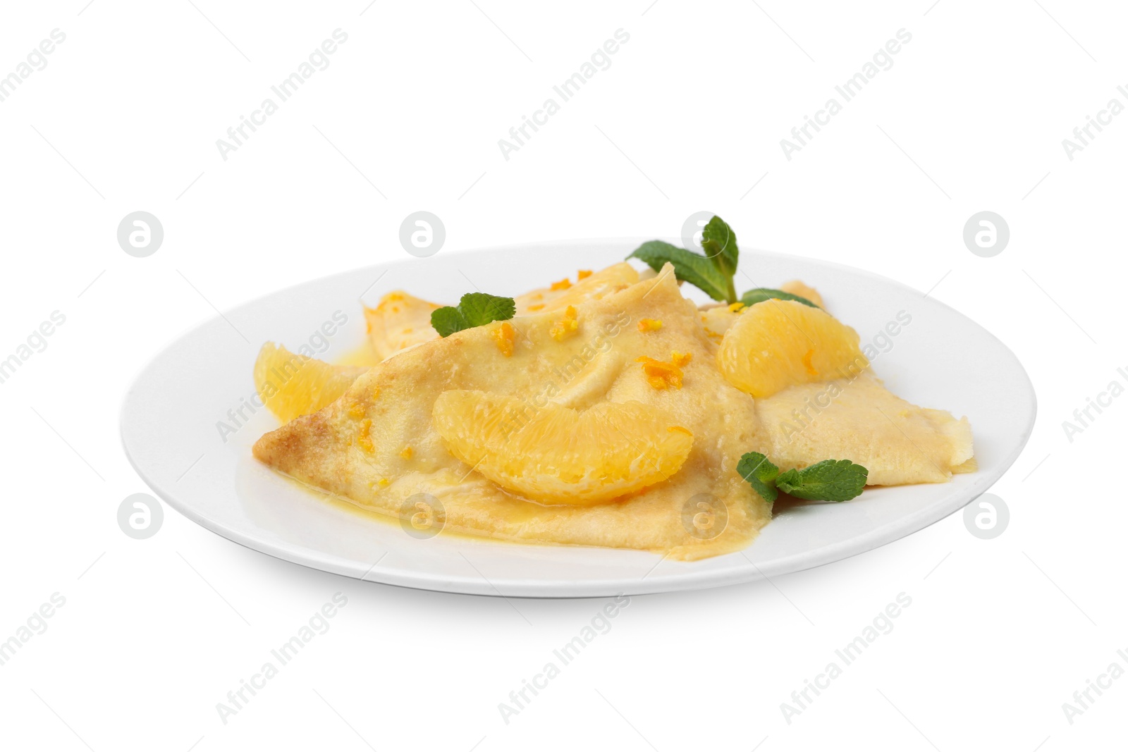 Photo of Plate with tasty crepes Suzette isolated on white