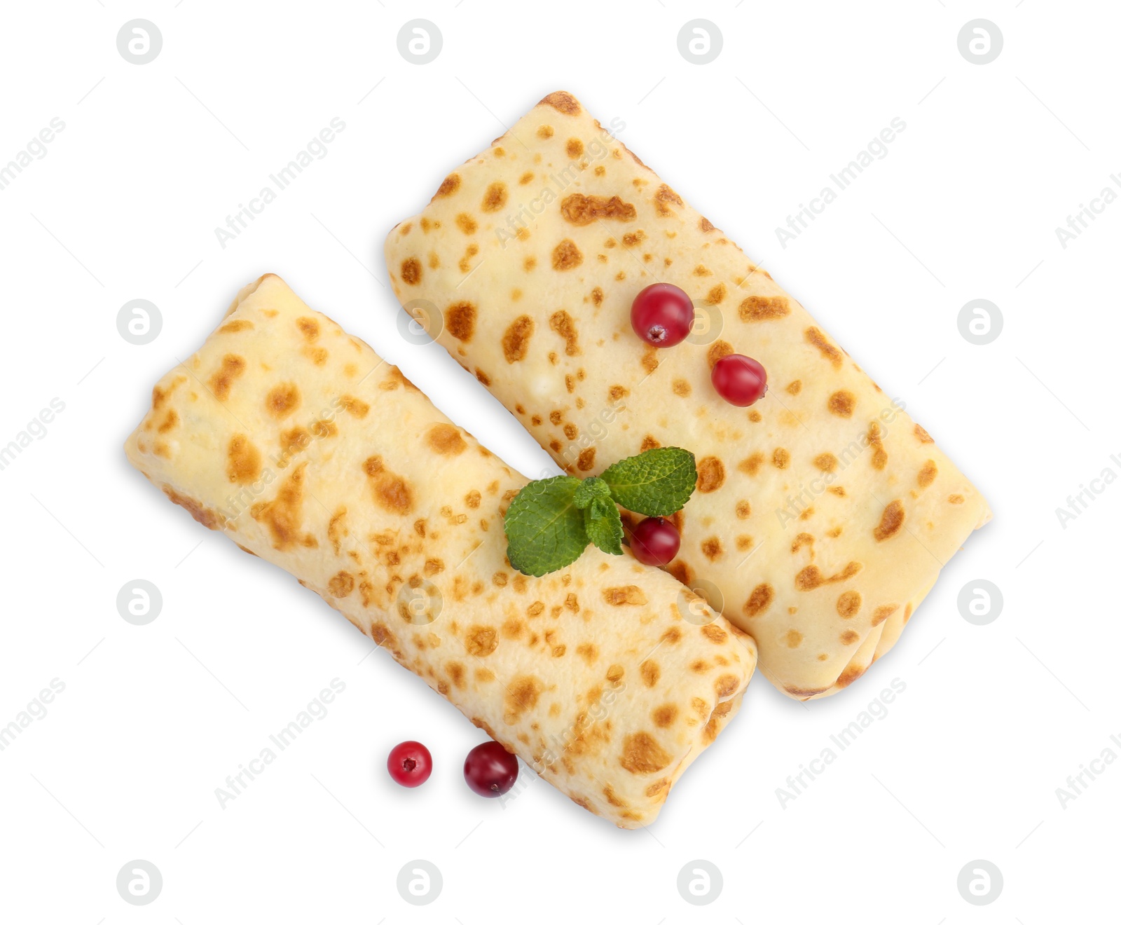 Photo of Delicious rolled crepes with cranberries and mint isolated on white, top view