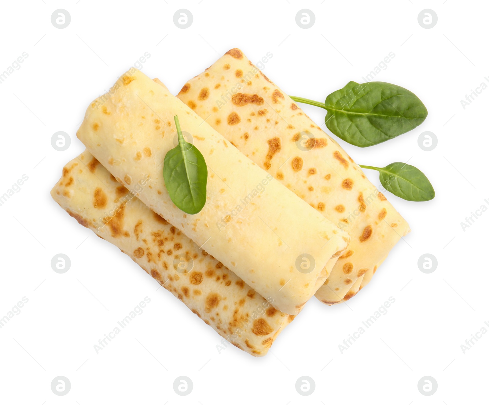 Photo of Delicious rolled crepes and basil isolated on white, top view