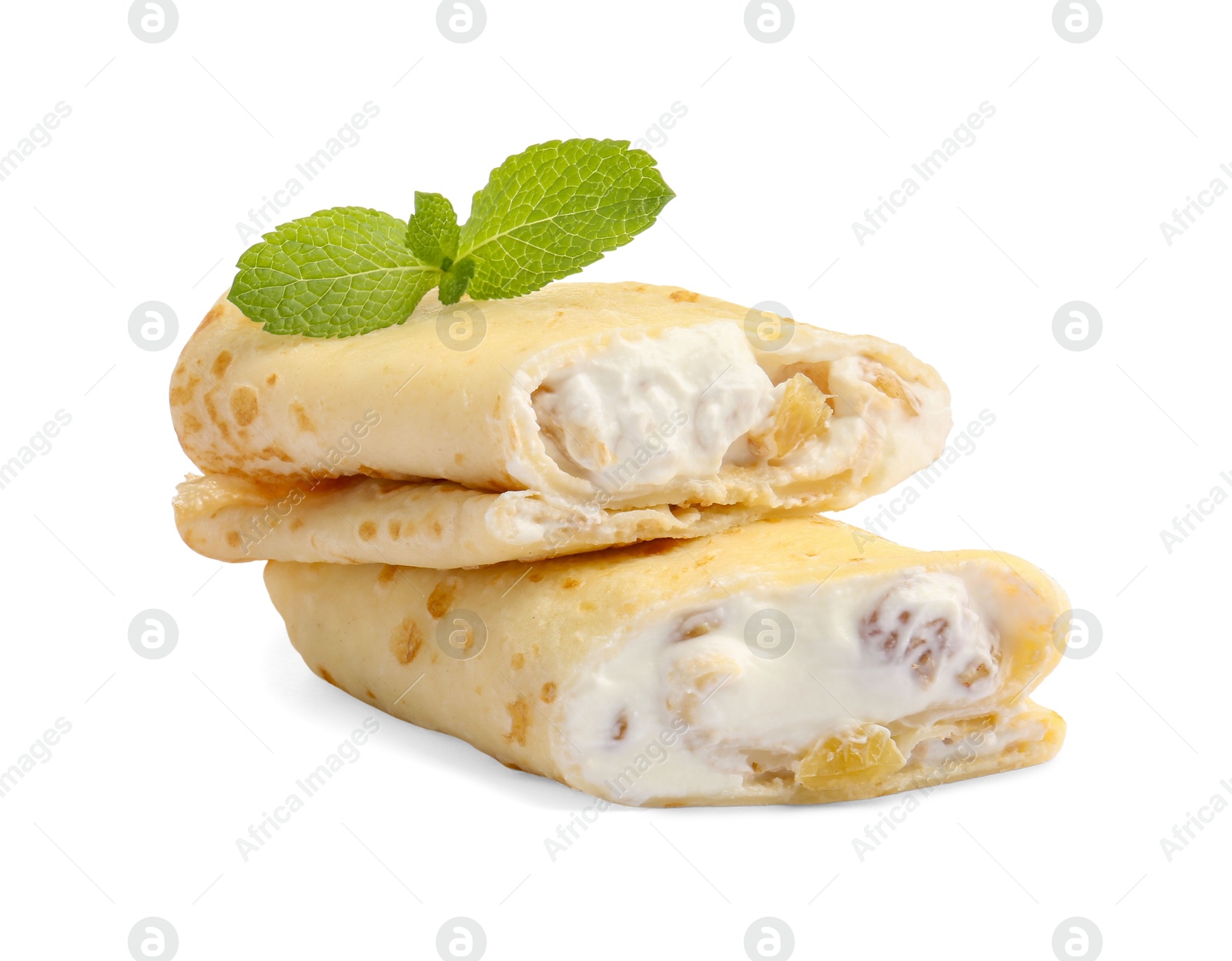 Photo of Delicious rolled crepes with cottage cheese, raisins and mint isolated on white