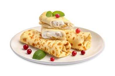 Photo of Delicious rolled crepes with cottage cheese, raisins, cranberries and mint isolated on white