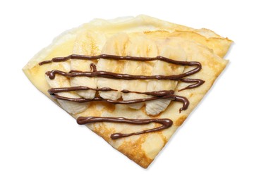 Delicious crepe with chocolate sauce and banana isolated on white, top view