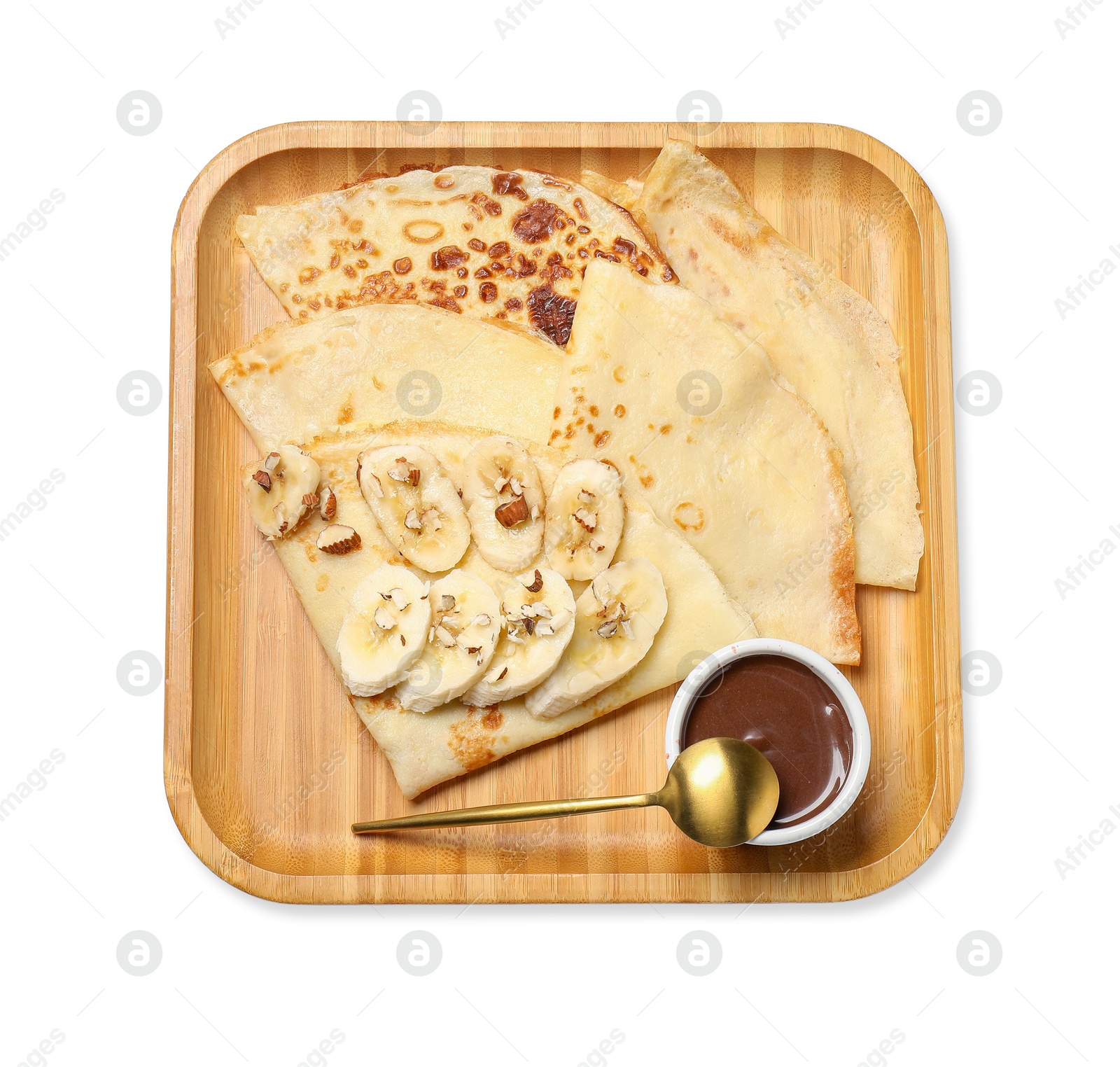 Photo of Delicious crepes with chocolate sauce, banana and almonds isolated on white, top view