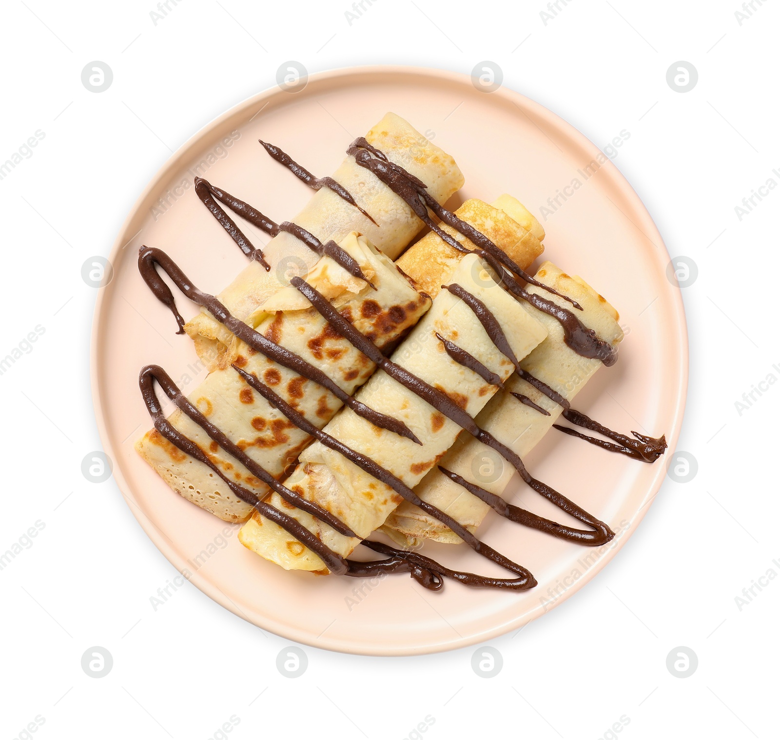 Photo of Delicious crepes with chocolate sauce isolated on white, top view