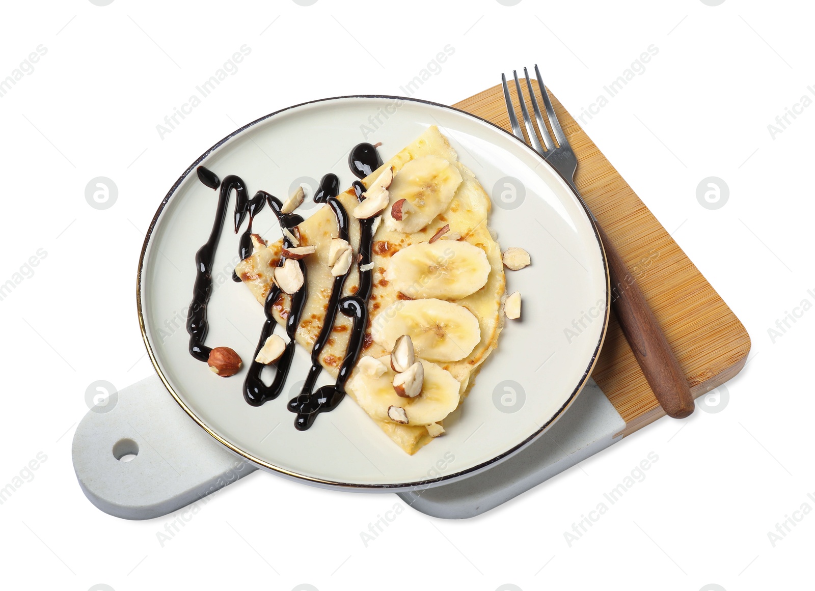 Photo of Delicious crepe with banana, nuts and chocolate sauce isolated on white, above view