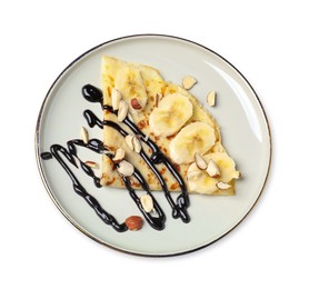 Delicious crepe with banana, nuts and chocolate sauce isolated on white, top view