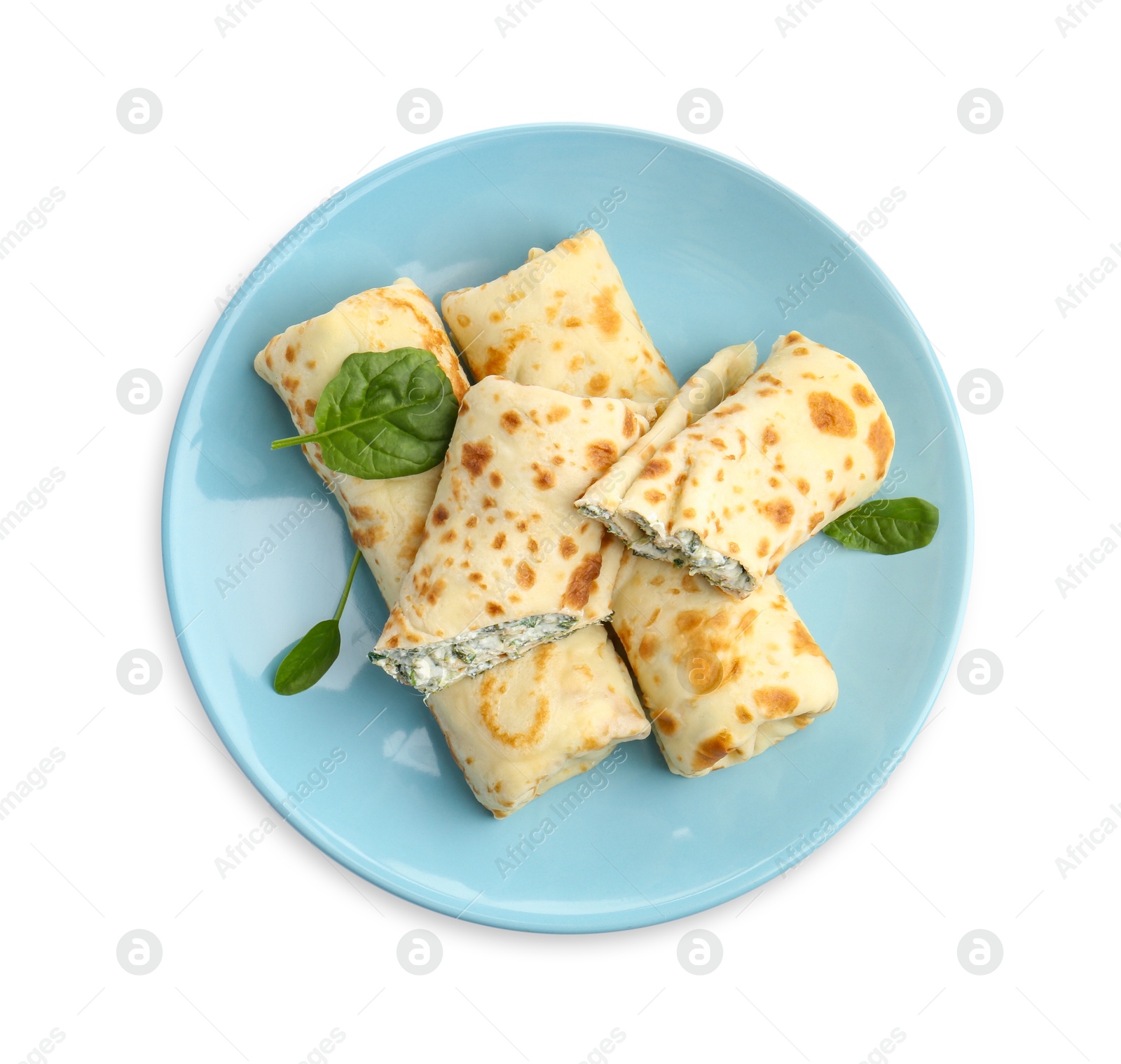 Photo of Tasty rolled crepes with cottage cheese and spinach isolated on white, top view