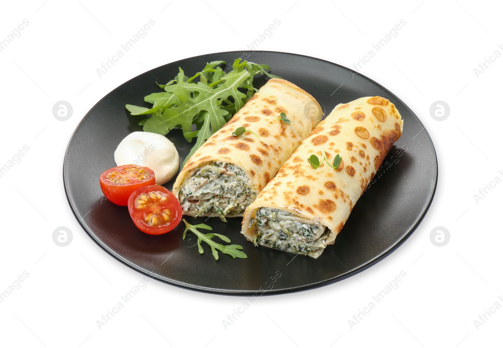 Photo of Tasty rolled crepes with cottage cheese, spinach, arugula and tomato isolated on white