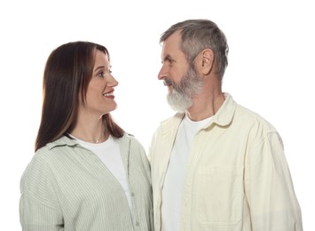 Photo of Happy daughter and her father looking at each other on white background