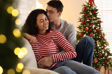 Photo of Happy couple spending time together at home. Christmas celebration