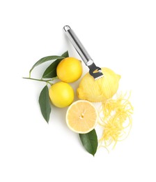 Photo of Lemon zest, fresh fruits and zester tool isolated on white, top view