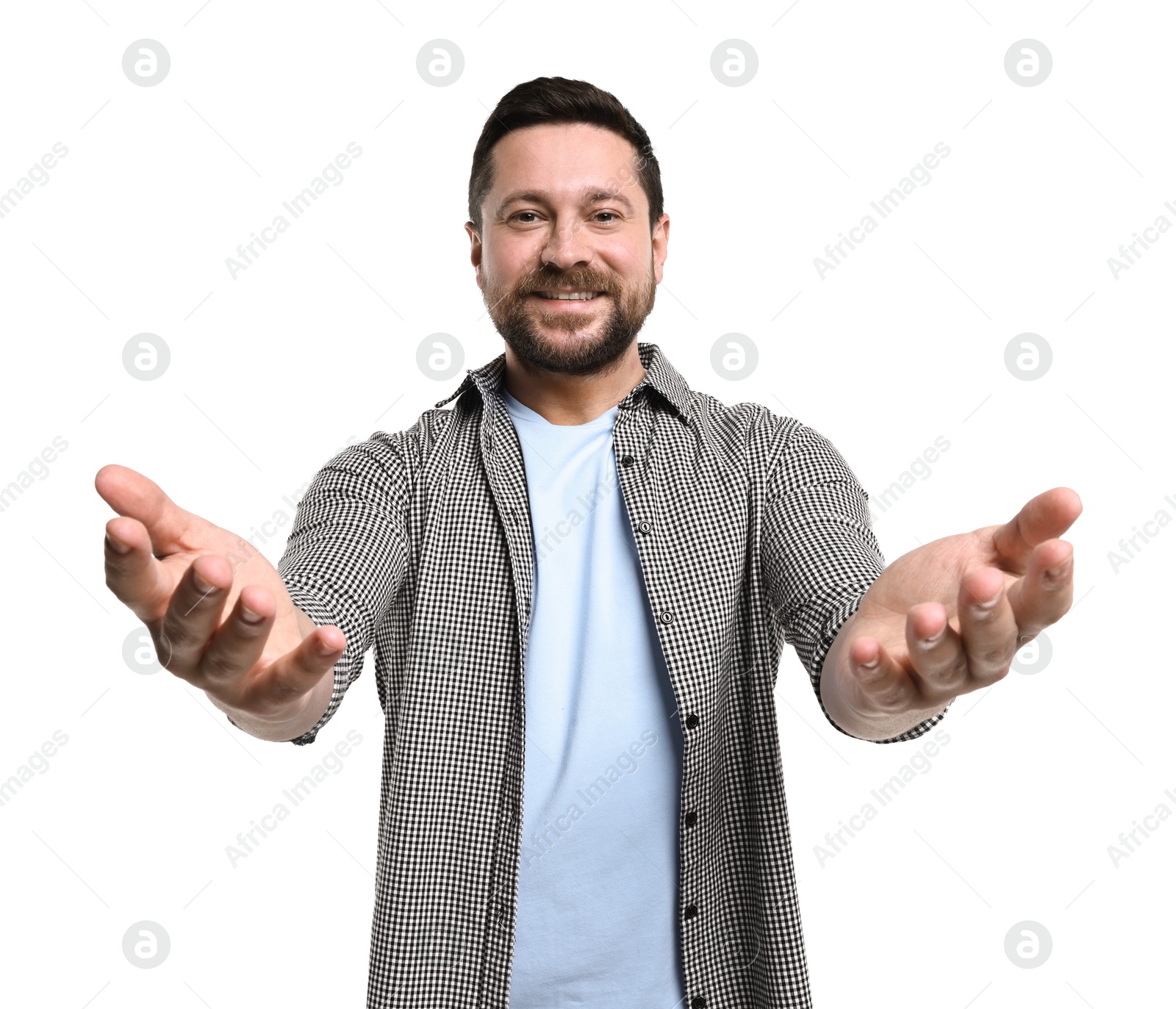 Photo of Happy man welcoming friends or guests on white background