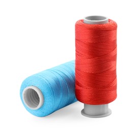 Photo of Spools of bright sewing threads isolated on white