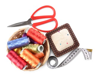 Photo of Different sewing supplies isolated on white, top view