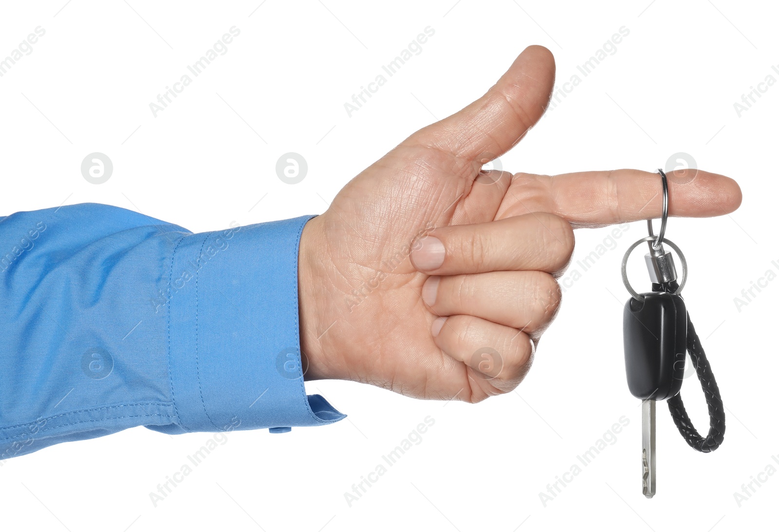 Photo of Man with car key and keychain on white background, closeup