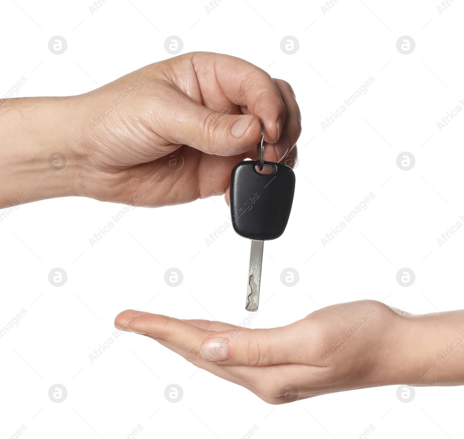 Photo of Dealer giving car key to customer on white background, closeup. Buying auto