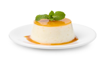 Photo of Tasty pudding with caramel sauce and mint isolated on white