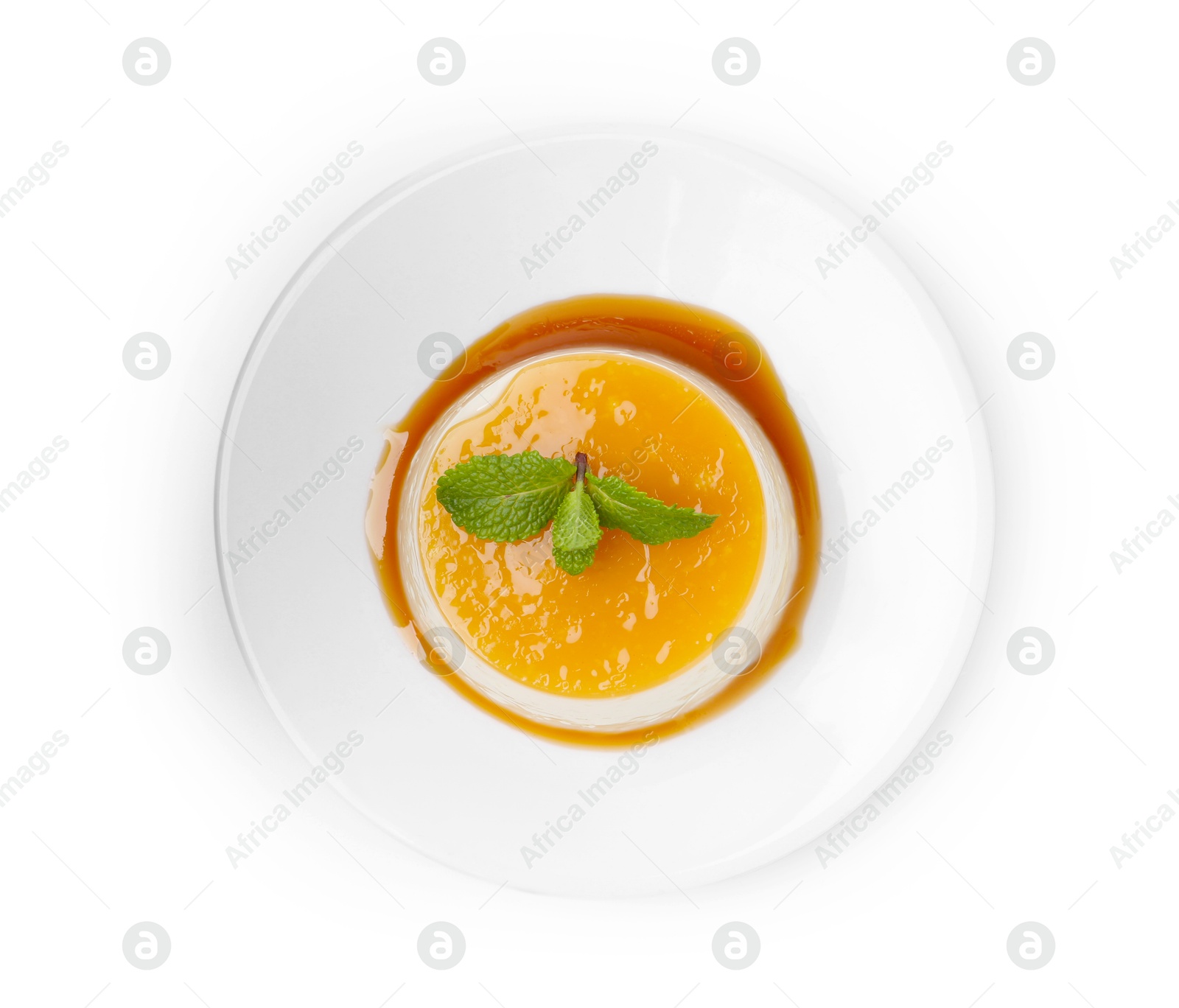 Photo of Tasty pudding with caramel sauce and mint isolated on white, top view