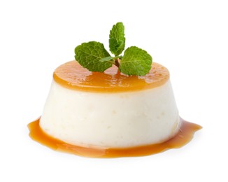 Photo of Tasty pudding with caramel sauce and mint isolated on white