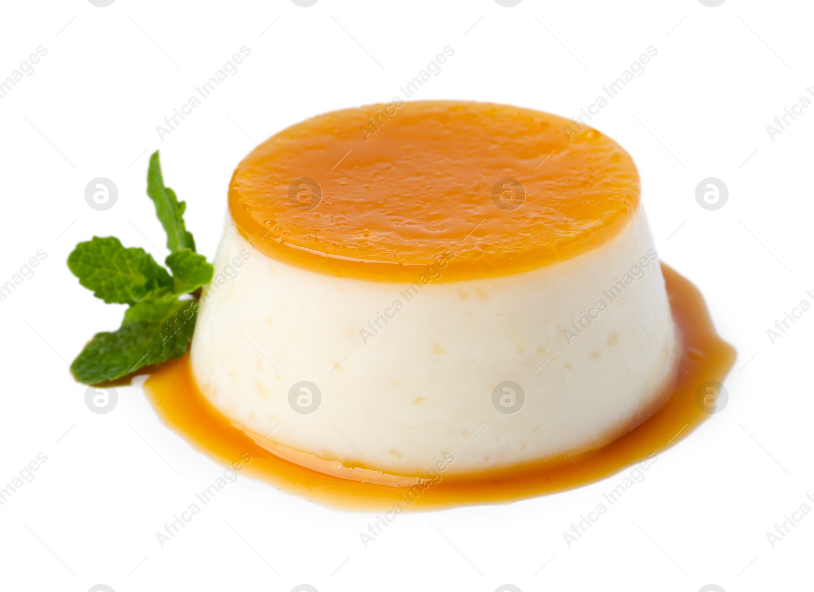 Photo of Tasty pudding with caramel sauce and mint isolated on white