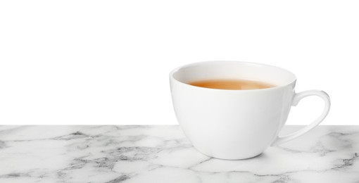 Photo of Refreshing green tea in cup on marble table against white background. Space for text