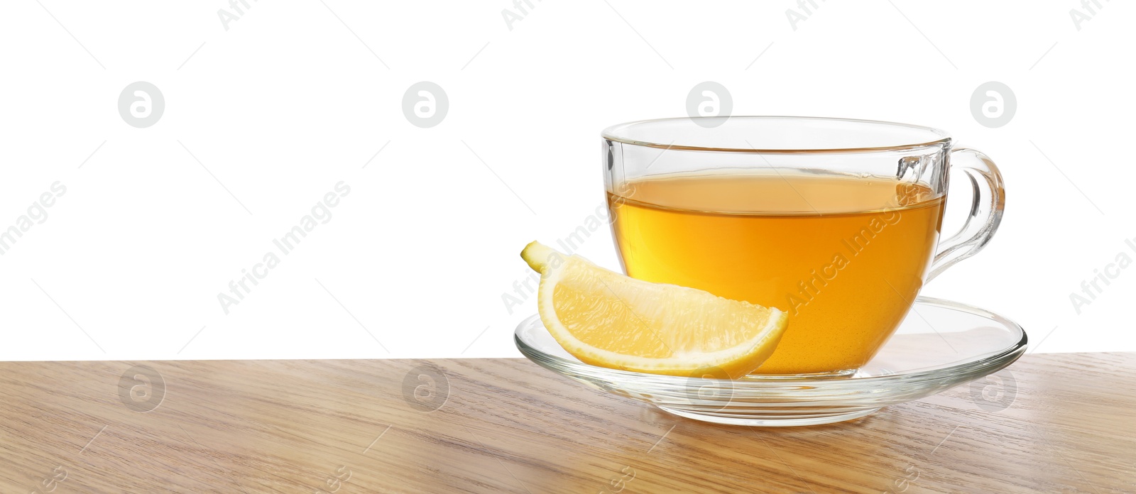 Photo of Refreshing green tea in cup and slice of lemon on wooden table against white background. Space for text