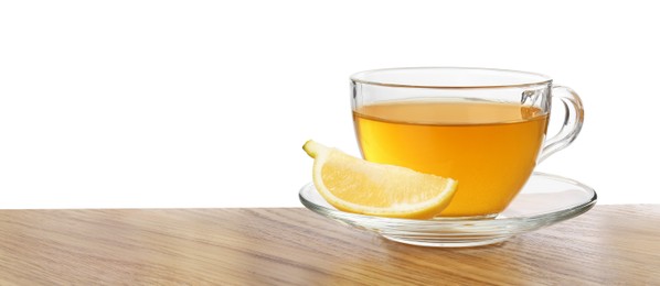 Photo of Refreshing green tea in cup and slice of lemon on wooden table against white background. Space for text