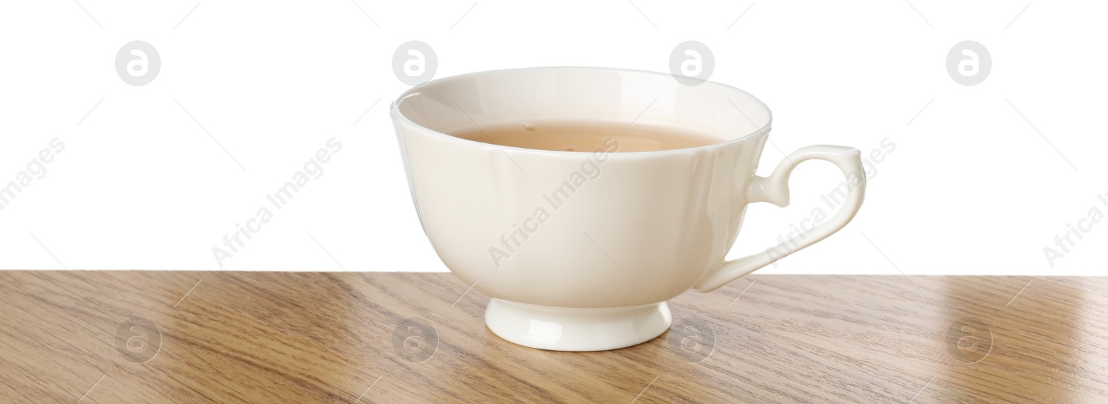 Photo of Refreshing green tea in cup on wooden table against white background