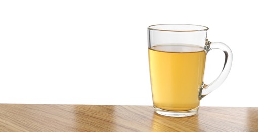 Refreshing green tea in cup on wooden table against white background. Space for text