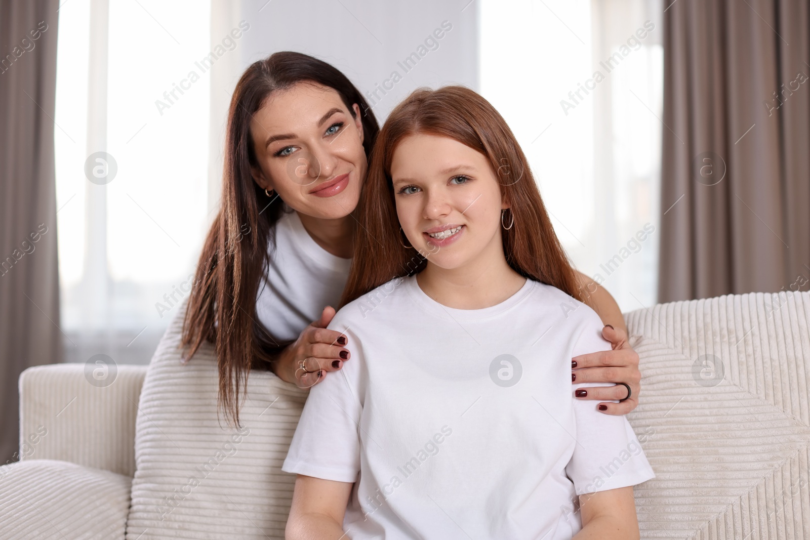 Photo of Portrait of beautiful mother with teenage daughter at home