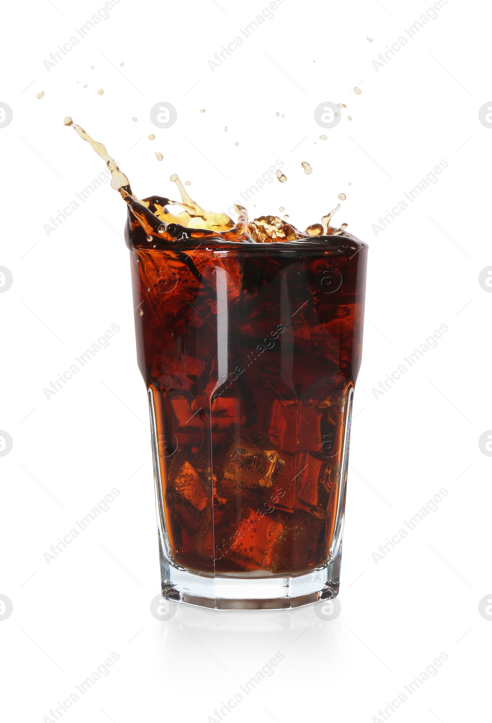 Photo of Refreshing cola with ice cubes splashing in glass isolated on white