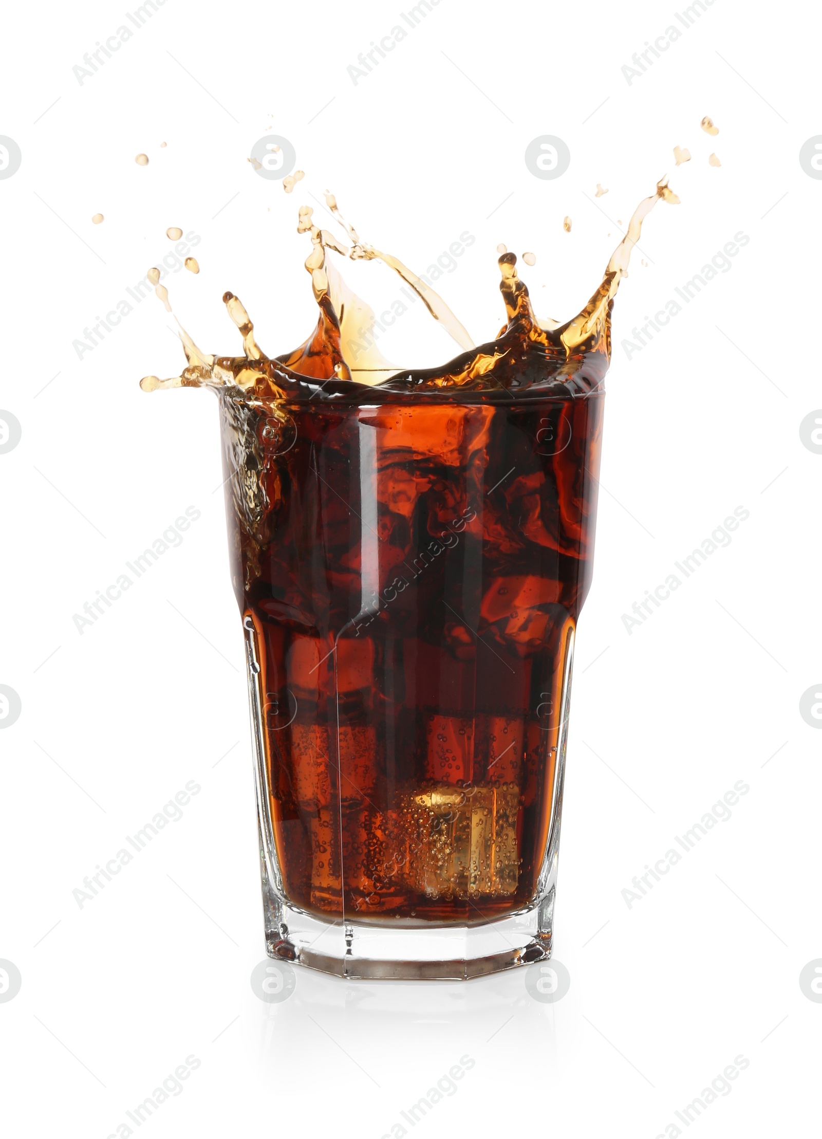 Photo of Refreshing cola with ice cubes splashing in glass isolated on white