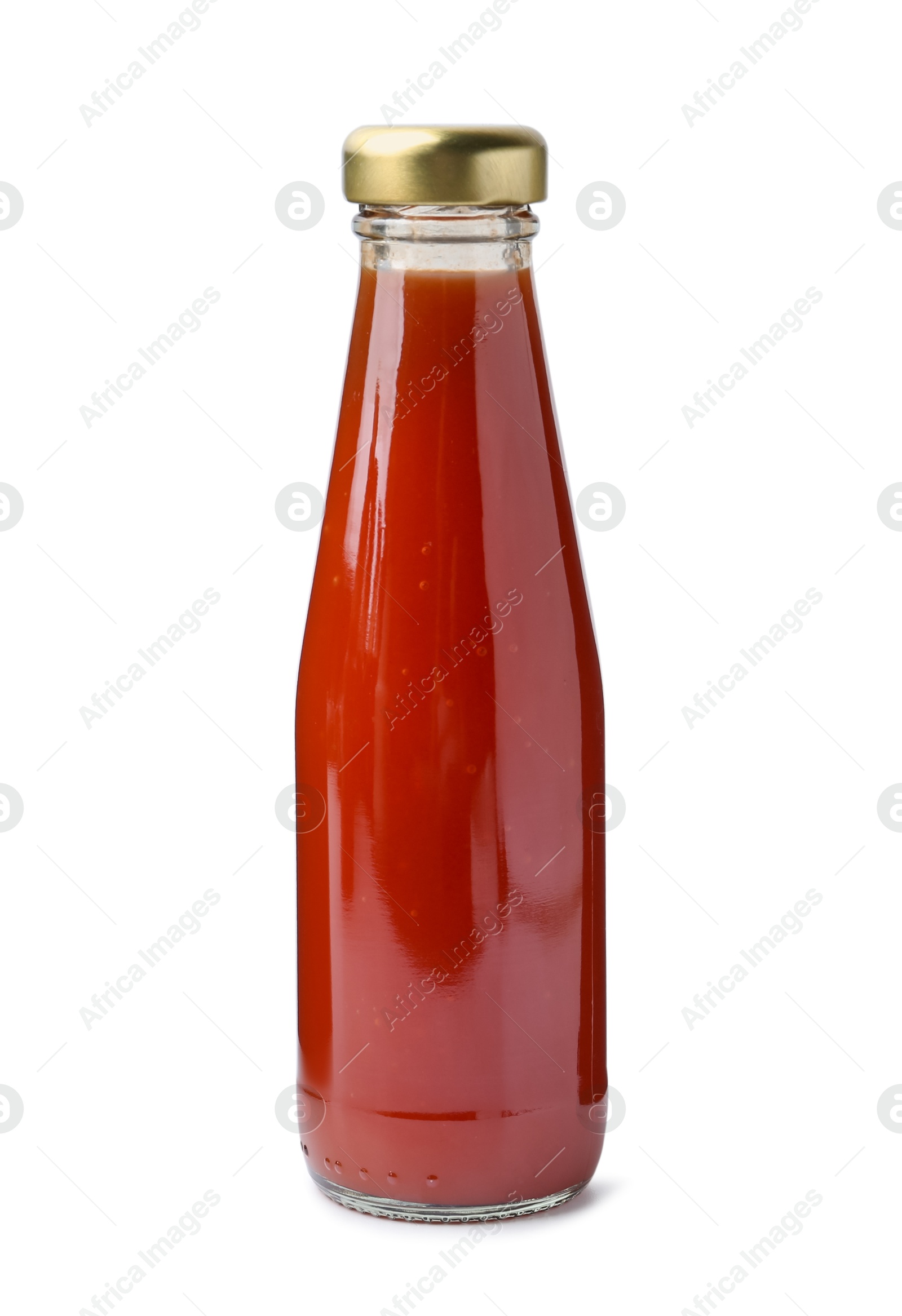 Photo of Delicious sauce in glass bottle isolated on white