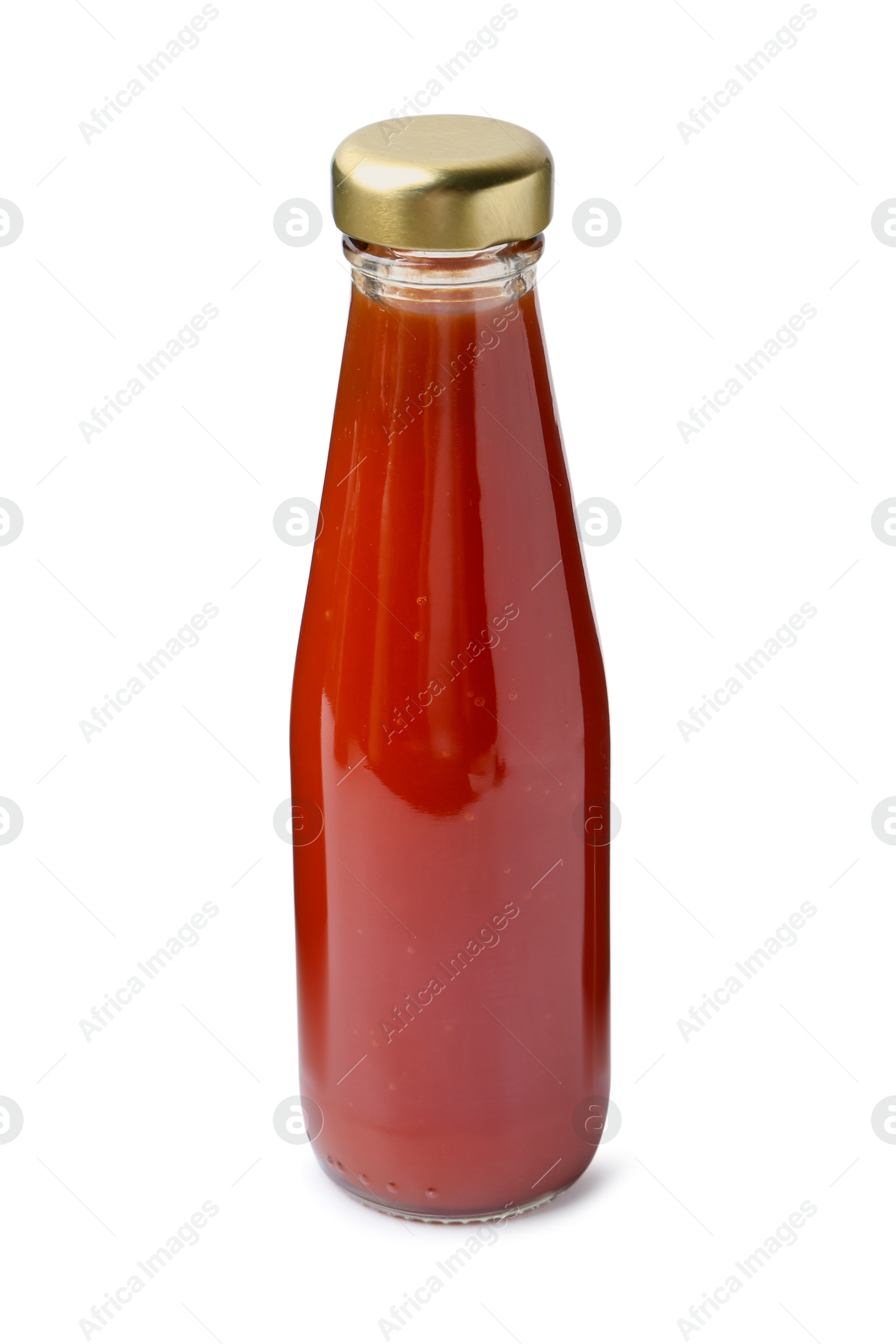 Photo of Delicious sauce in glass bottle isolated on white