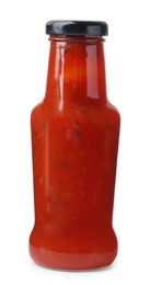 Photo of Delicious sauce in glass bottle isolated on white