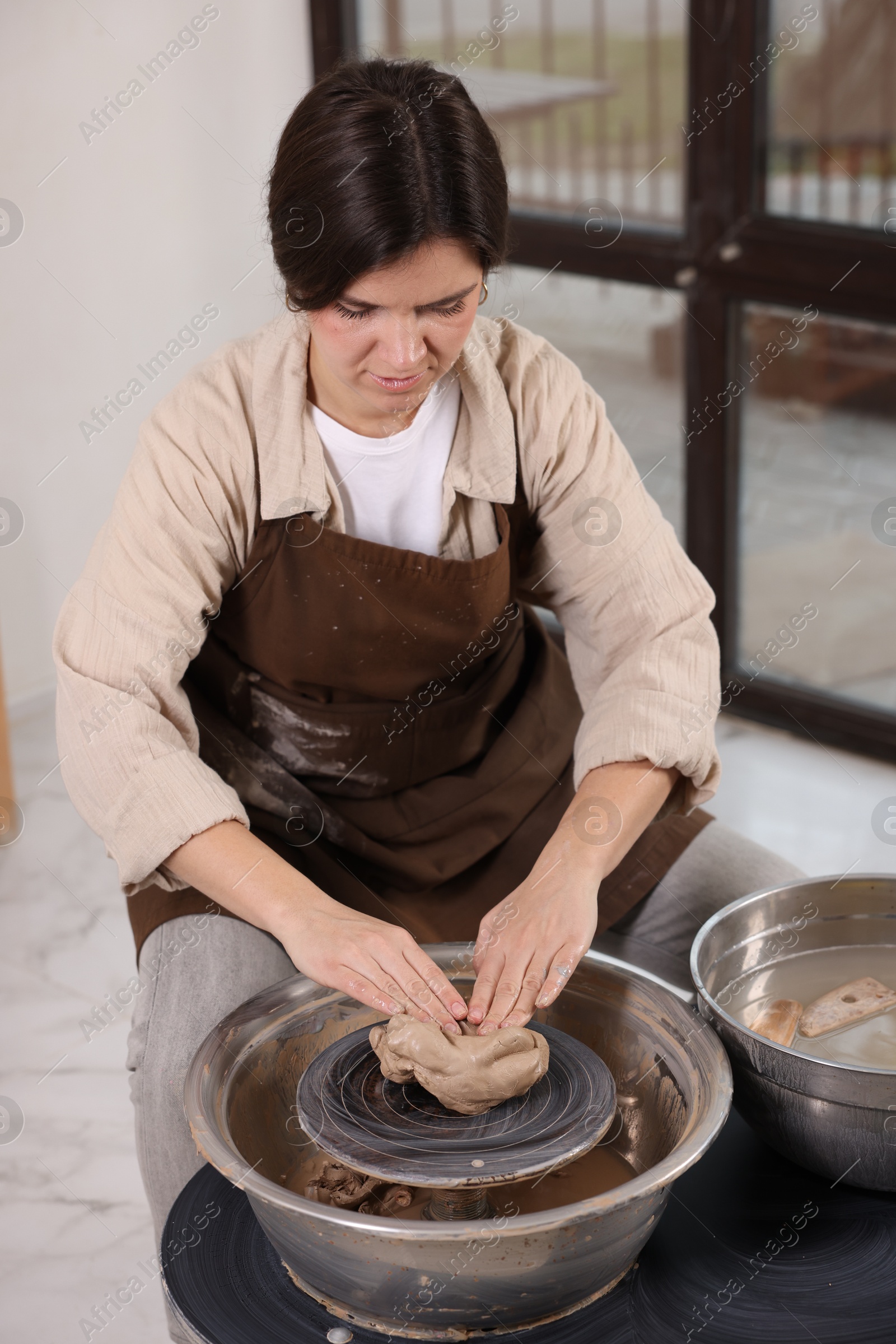 Photo of Hobby and craft. Woman making pottery indoors