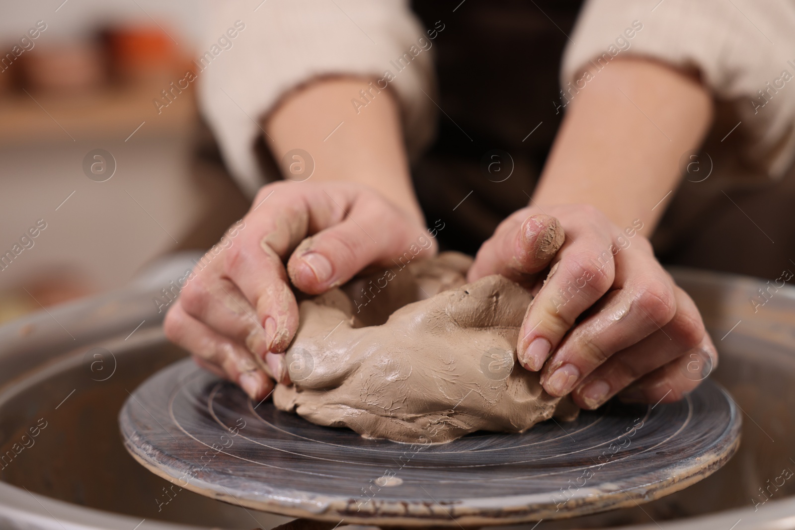 Photo of Hobby and craft. Woman making pottery indoors, closeup