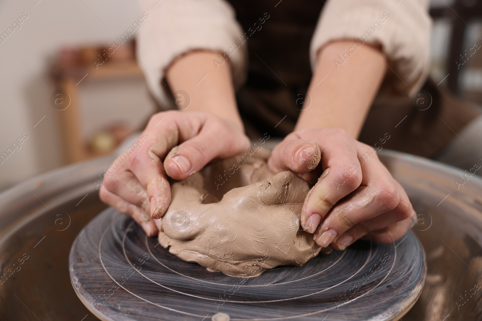 Photo of Hobby and craft. Woman making pottery indoors, closeup