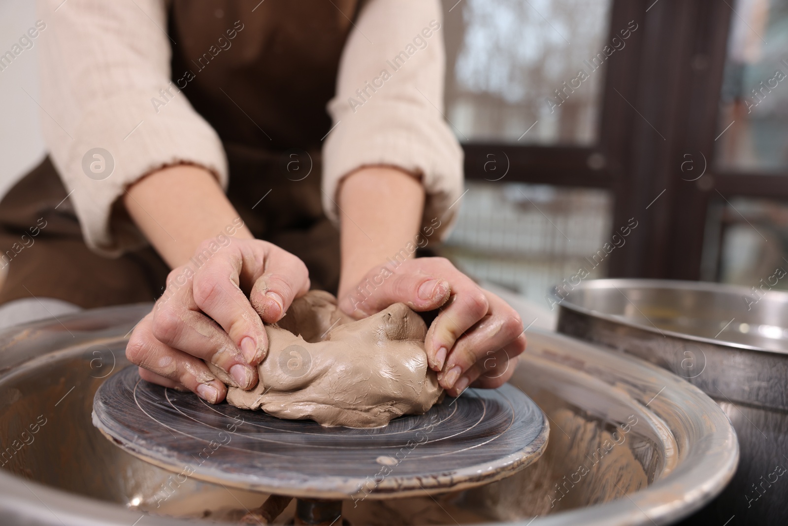 Photo of Hobby and craft. Woman making pottery indoors, closeup