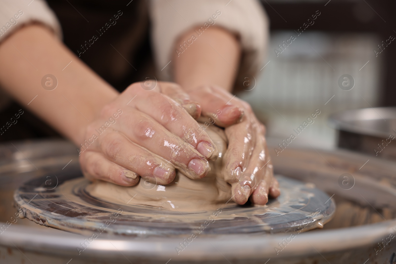 Photo of Hobby and craft. Woman making pottery indoors, closeup