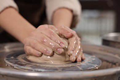 Photo of Hobby and craft. Woman making pottery indoors, closeup