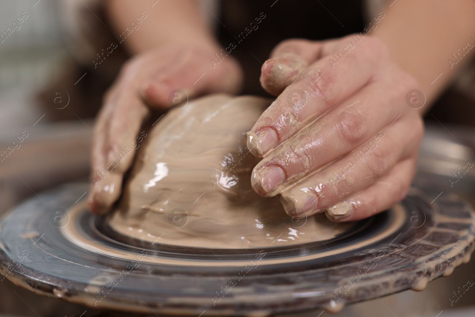 Photo of Hobby and craft. Woman making pottery indoors, closeup