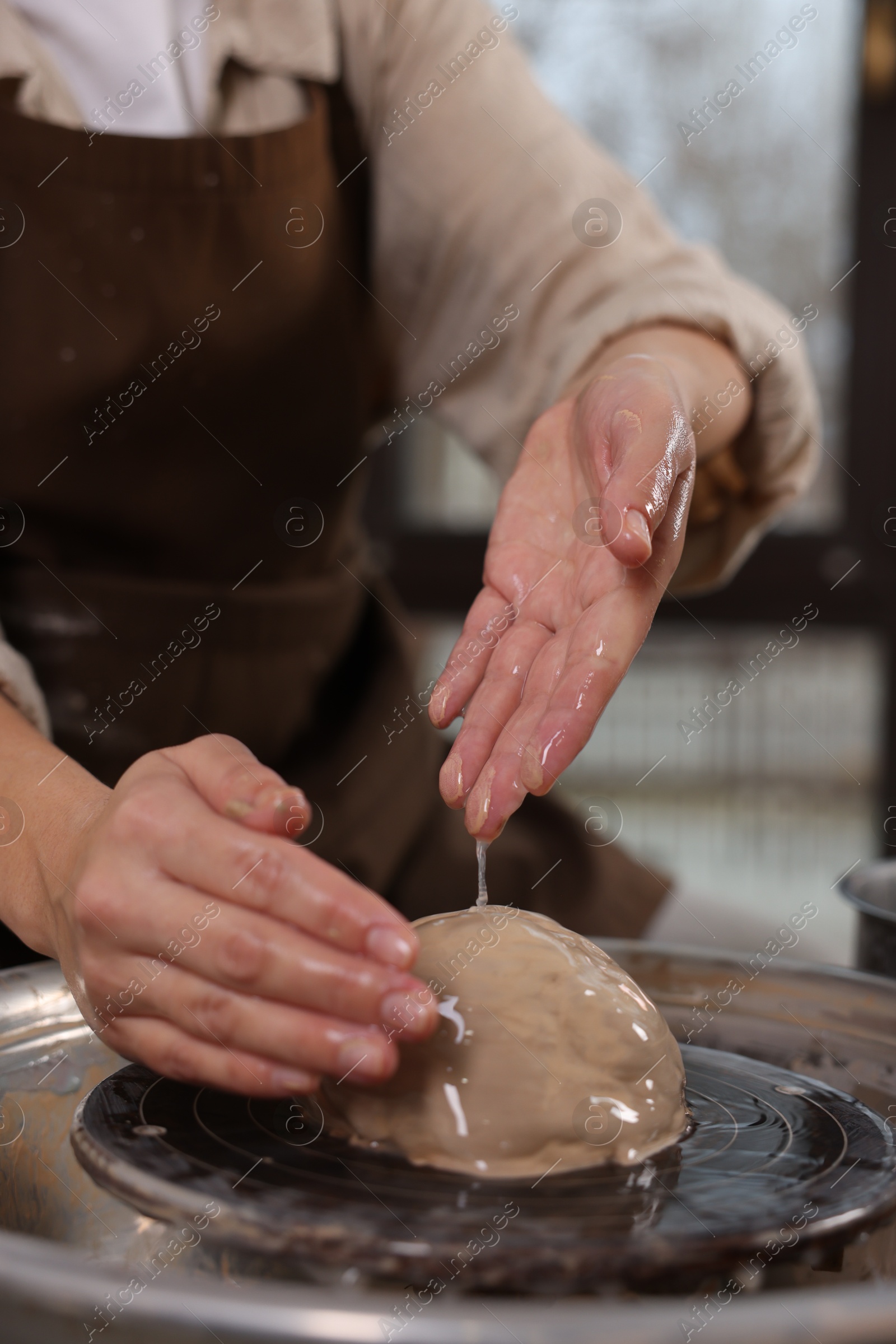 Photo of Hobby and craft. Woman making pottery indoors, closeup